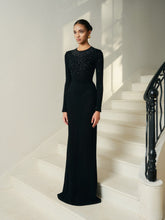 Full-length embellished evening dress with long sleeves and fitted silhouette